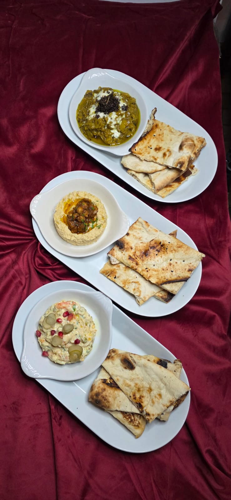 Persian tea set with decorative red teapot, matching sugar bowl, and cups.