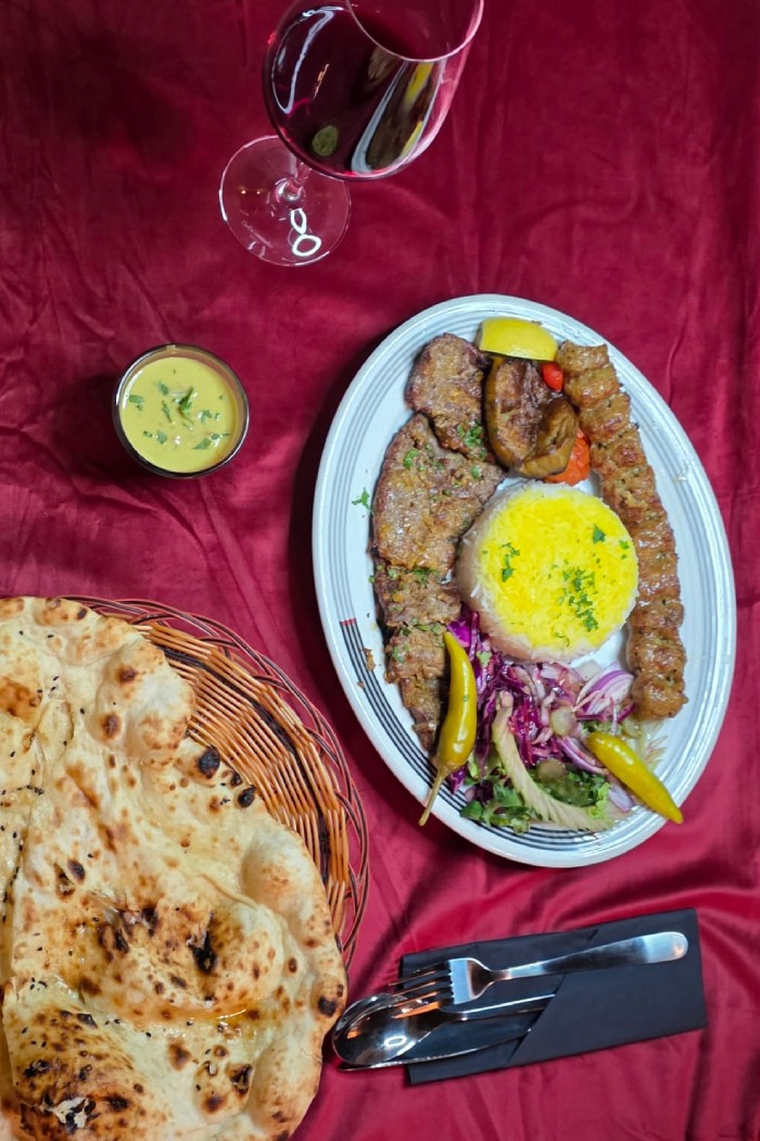 Ziba Restaurant’s Soltani Kebab with a mound of saffron rice, salad, and flatbread in 
Dunfermline. 