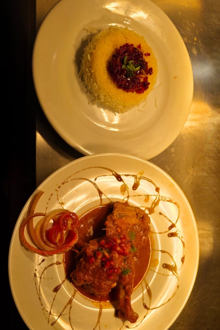 Ziba Restaurant’s Saffron rice topped with bright, jeweled barberries, served alongside a piece 
of chicken in Dunfermline.